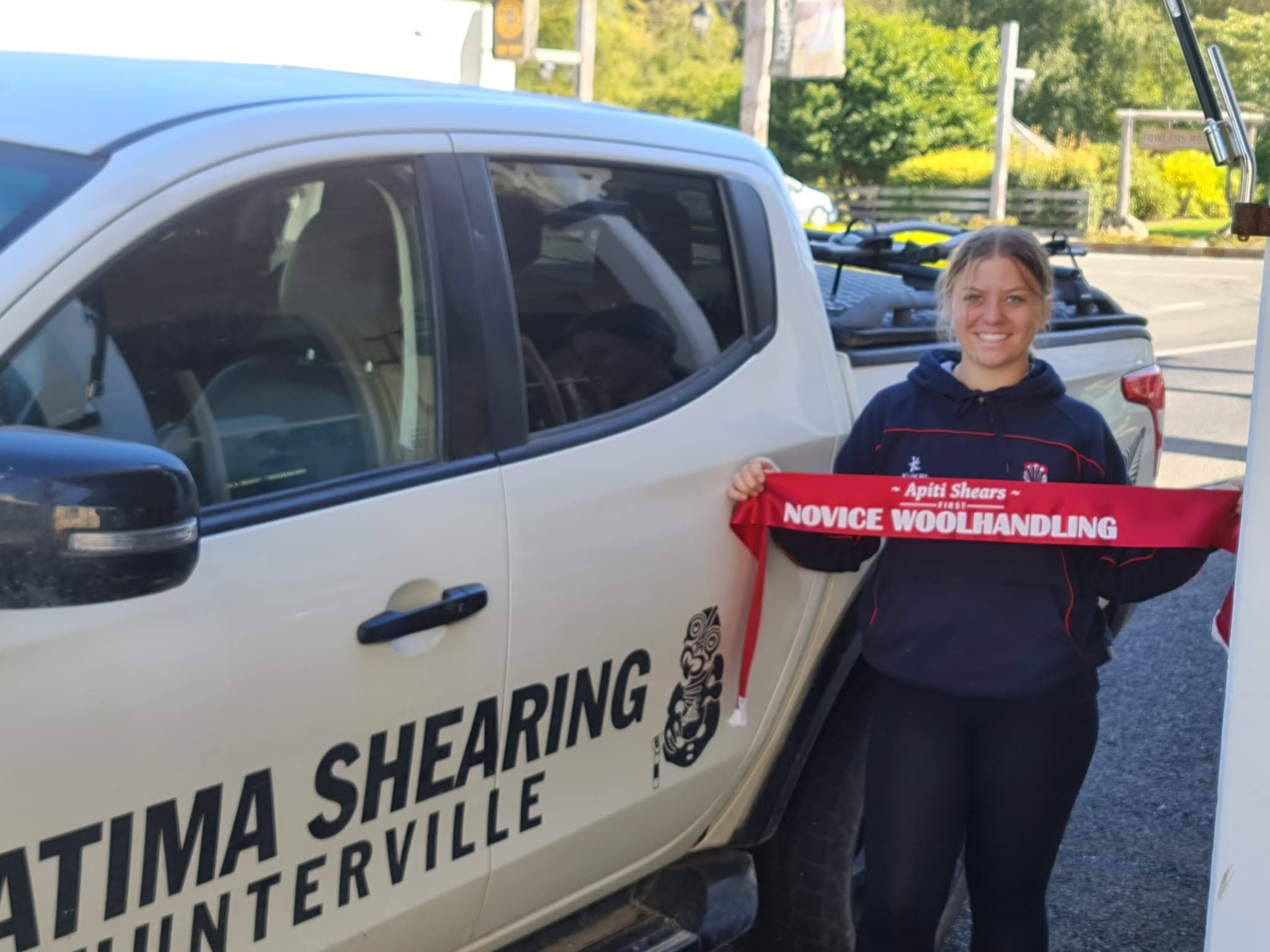 Ratima Shearing team member with an Apiti Shears Novice Woolhandling ribbon